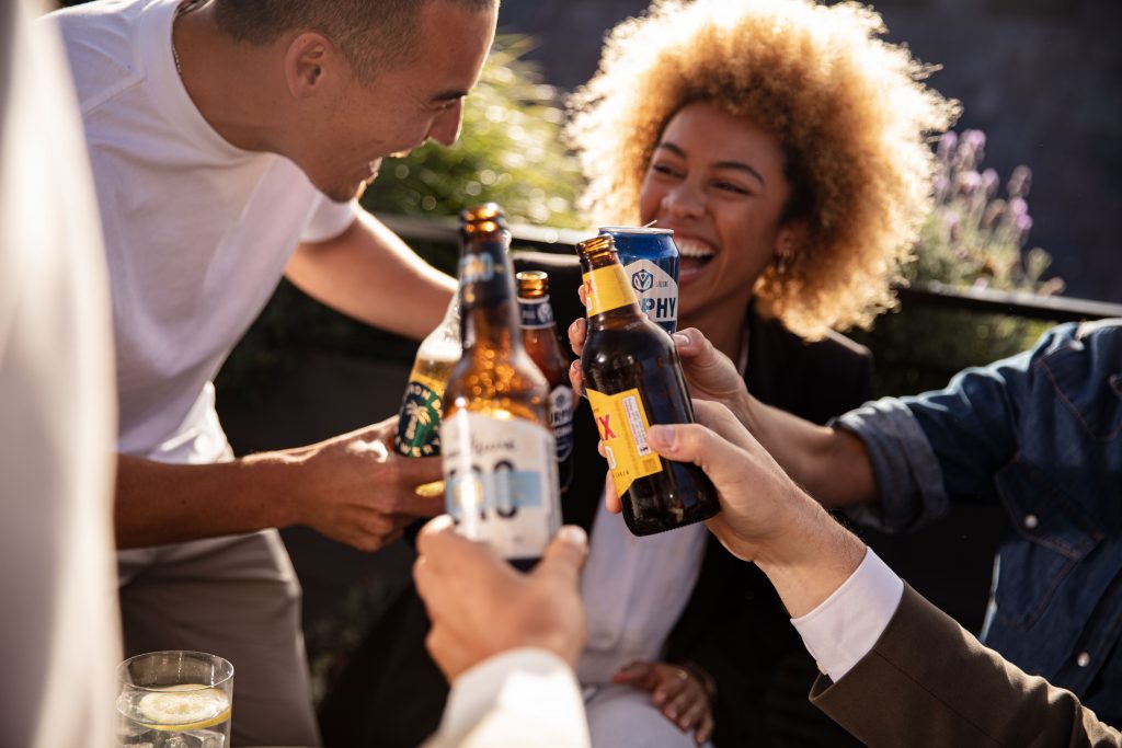 Group of adults holding glasses of alcohol beveraged