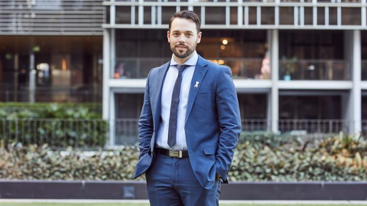 A man in a suit standing up