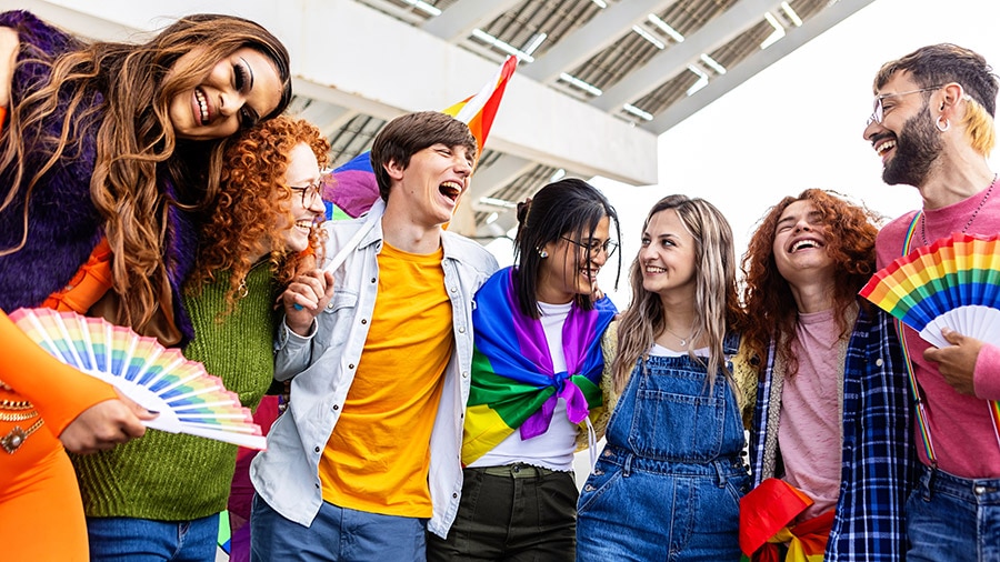 A diverse group of people standing next to each other.