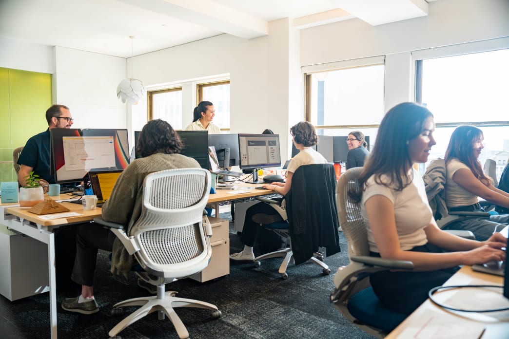 Orchard coworkers working at desks