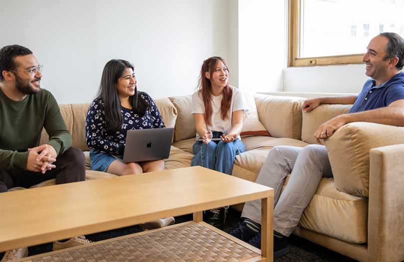 Four Orchard employees working in our Austin office lounge