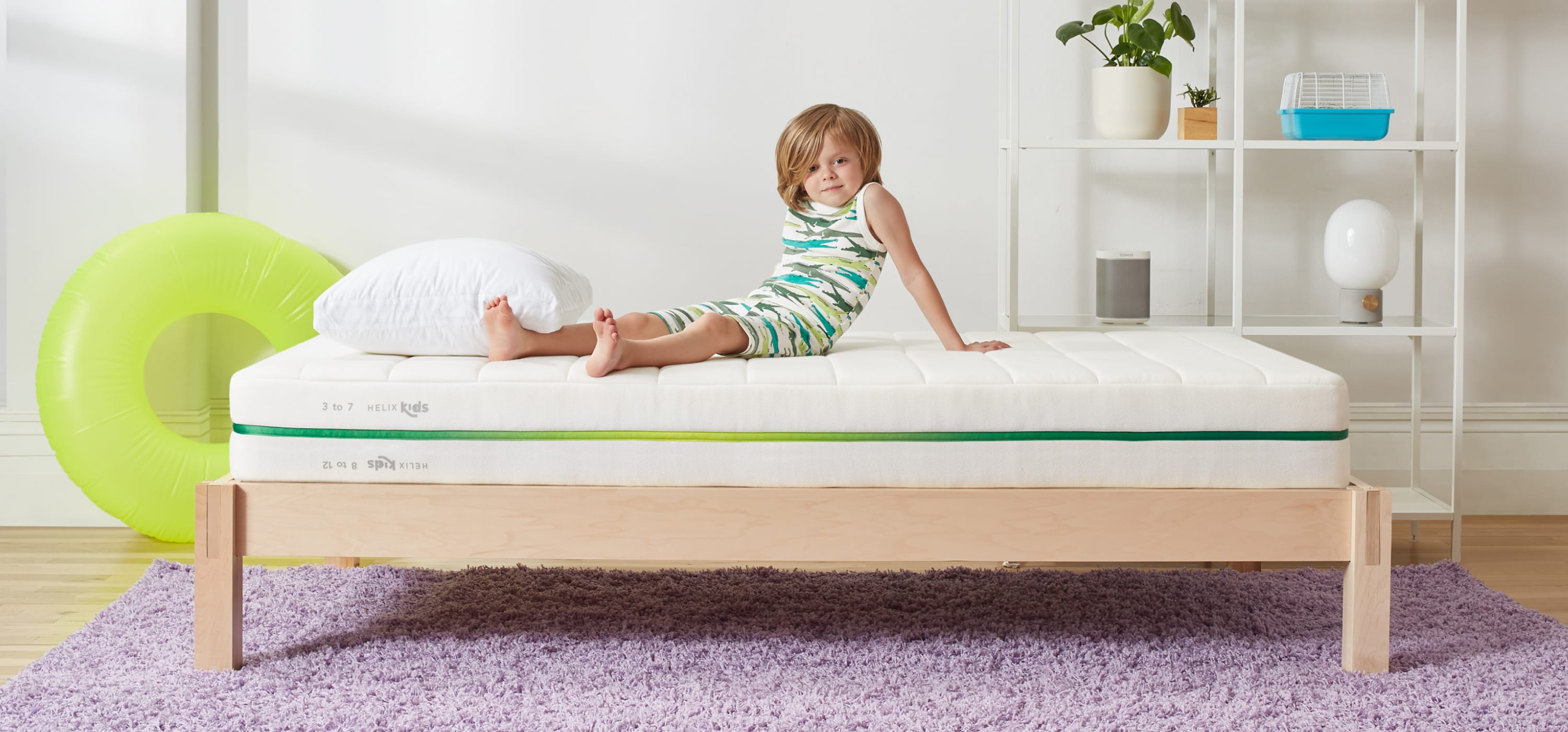 Child laying on Helix Kids mattress