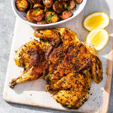 Chicken Under a Brick with Herb-Roasted Potatoes