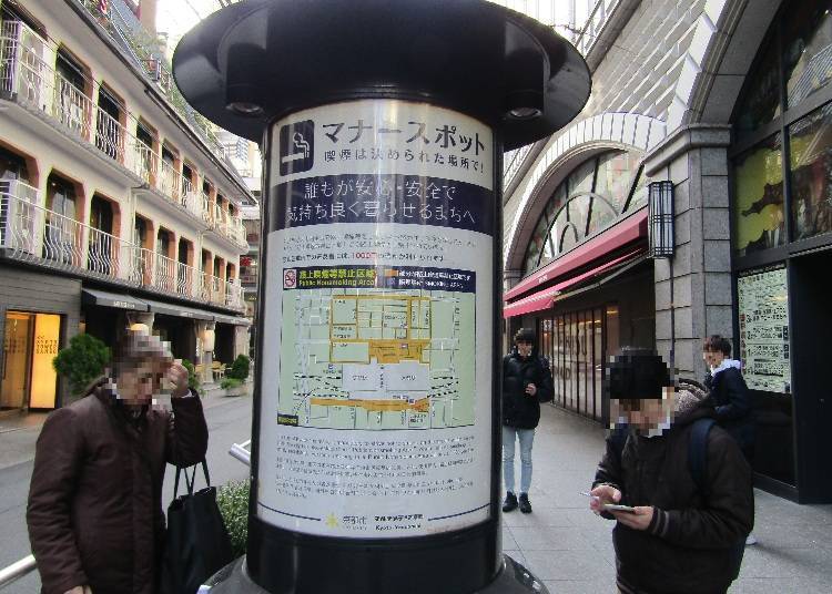 Smoking corner along the road (ash trays are provided around the pillar)