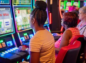 guests sitting at gaming machines