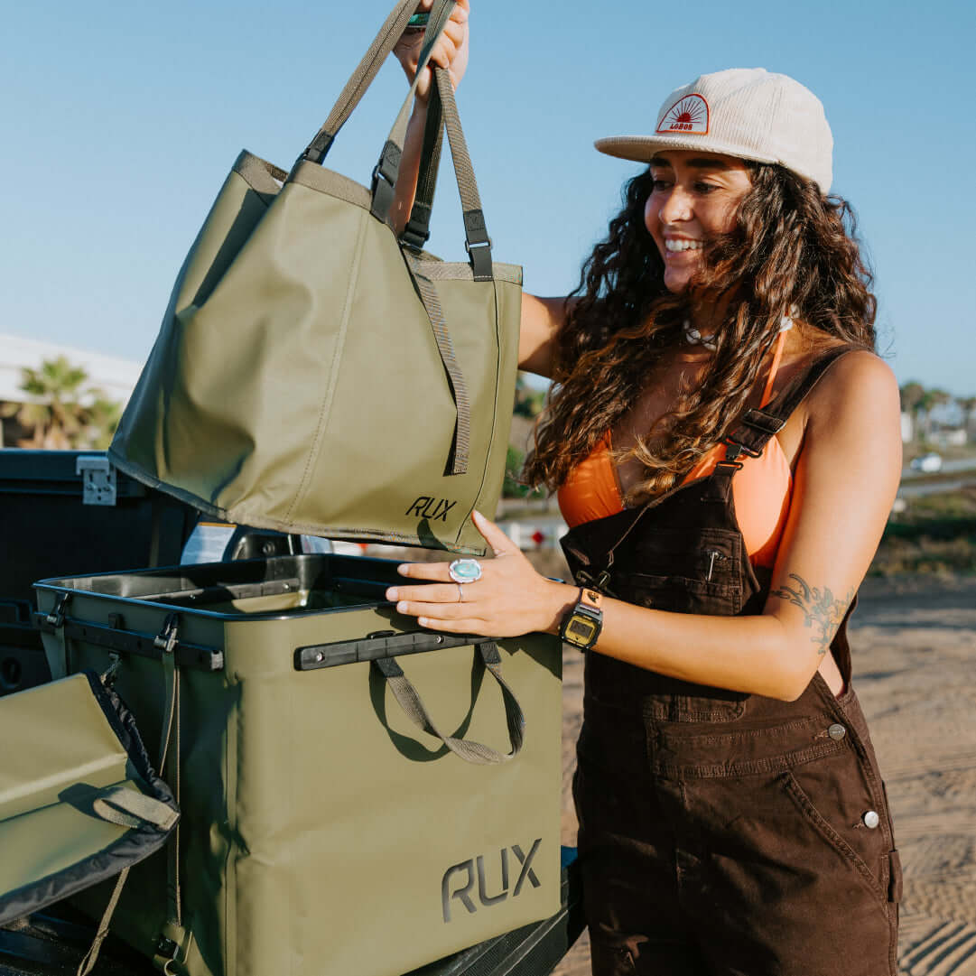 RUX 70L and a RUX Bag at the beach