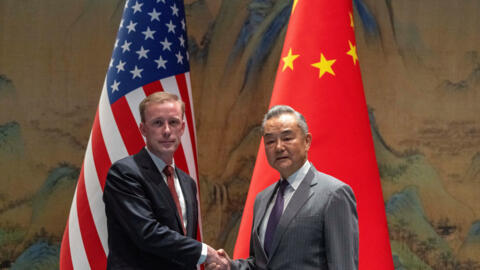 Wang Yi, the director of the Communist Party's Central Foreign Affairs Commission Office shakes hands with White House National Security Adviser Jake Sullivan at Yanqi Lake in Beijing, China, Tuesday,