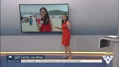 Turistas levam sobra da ceia de Natal para almoçar na praia no litoral de SP - Desde a última sexta-feira (20), 365 mil veículos desceram em direção à Baixada Santista.