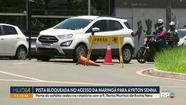 Pista da rotatória da avenida Maringá para a Ayrton Senna fica bloqueada - Parte do asfalto cedeu na rotatória com a rua Bento Munhoz da Rocha Neto.