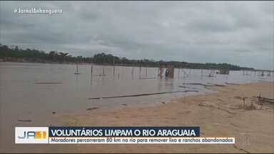 Voluntários limpam o Rio Araguaia - Moradores percorreram 80 km no rio para remover lixo e ranchos abandonados.