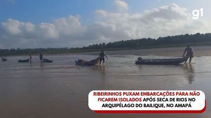 Ribeirinhos puxam embarcações para não ficarem isolados após seca de rios no Amapá