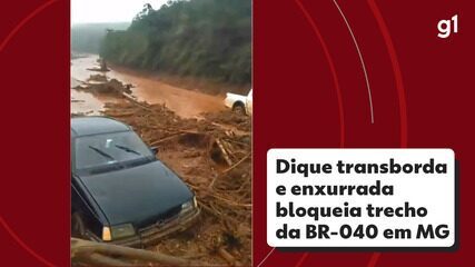 Dique em MG transborda e enxurrada bloqueia trecho BR-040; entenda