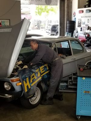 Photo of Bay Motor Works - San Francisco, CA, US. Master Si Fu working on a 1976 bmw 2002