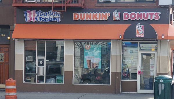 Photo of Dunkin' - New York, NY, US.  a dunkin donuts store on a city street