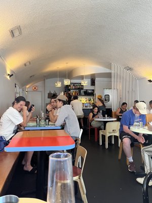 Photo of Dimes - New York, NY, US. people sitting at tables in a restaurant