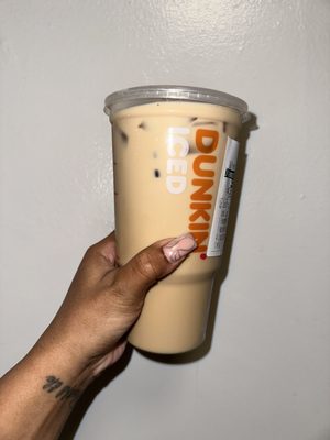 Photo of Dunkin' - New York, NY, US.  a hand holding a cup of coffee