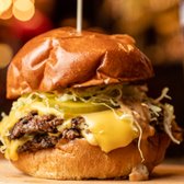 SMASHBUGER, fancy sauce, shaved onions, American cheese, dill pickles, shredded lettuce available with single, double or Impossible patty