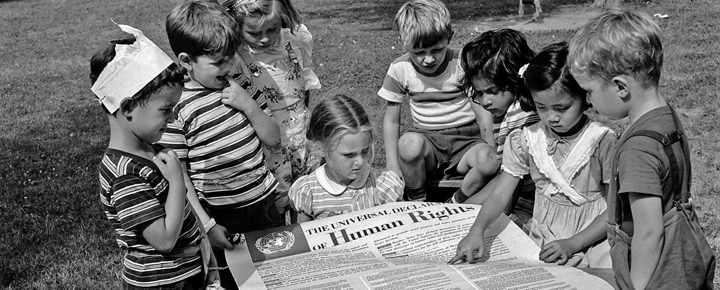 Children reading the Human Rights Declaration