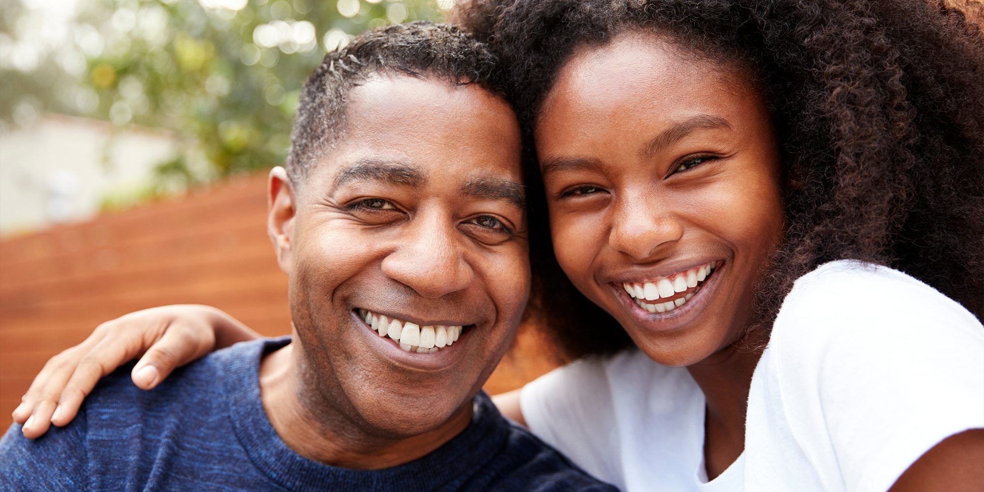 Father and Daughter smiling