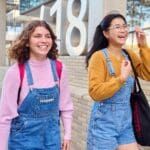 Two students walking on campus