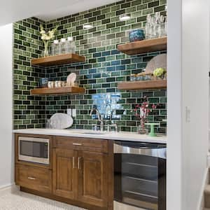 A basement kitchenette with beverage fridge and microwave