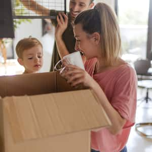 A family packing plates in the kitchen