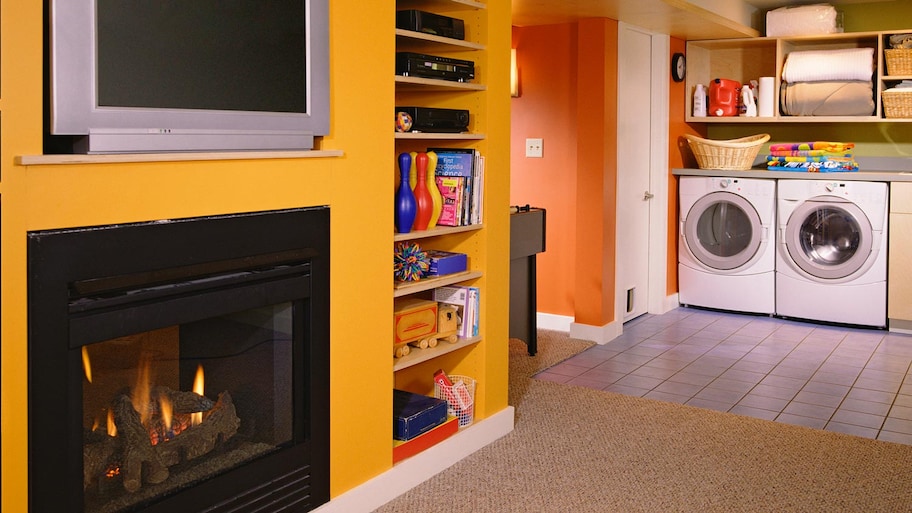 Entertainment and laundry room in a finished basement