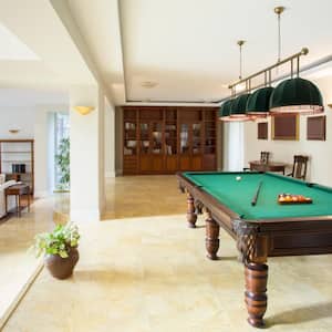 A living room with a pool table