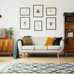 A living room with a vintage TV and retro furniture