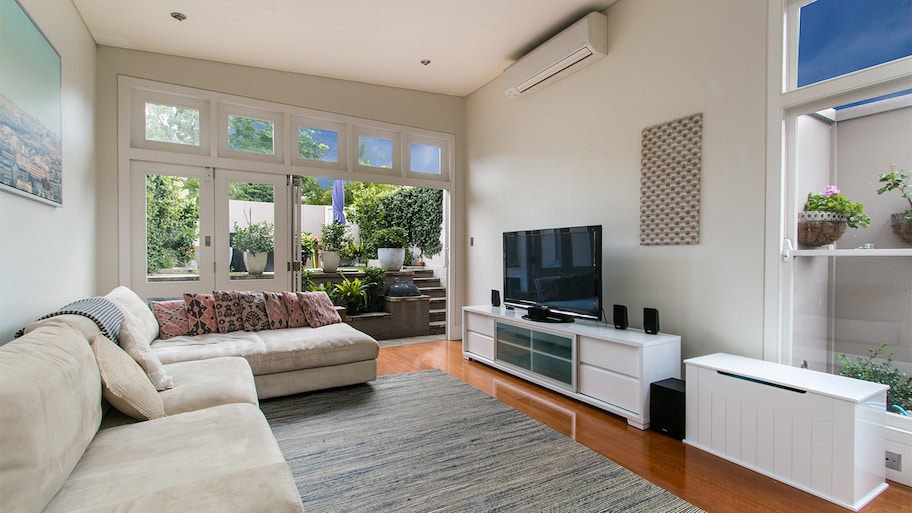 beautiful living room with ac and patio   