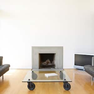  A lounge area with a contemporary concrete fireplace insert