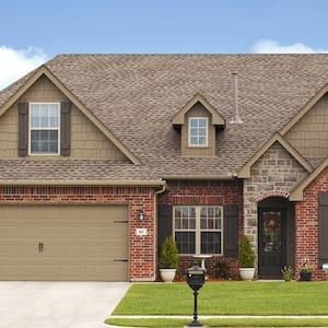 A luxurious house with the garage door closed