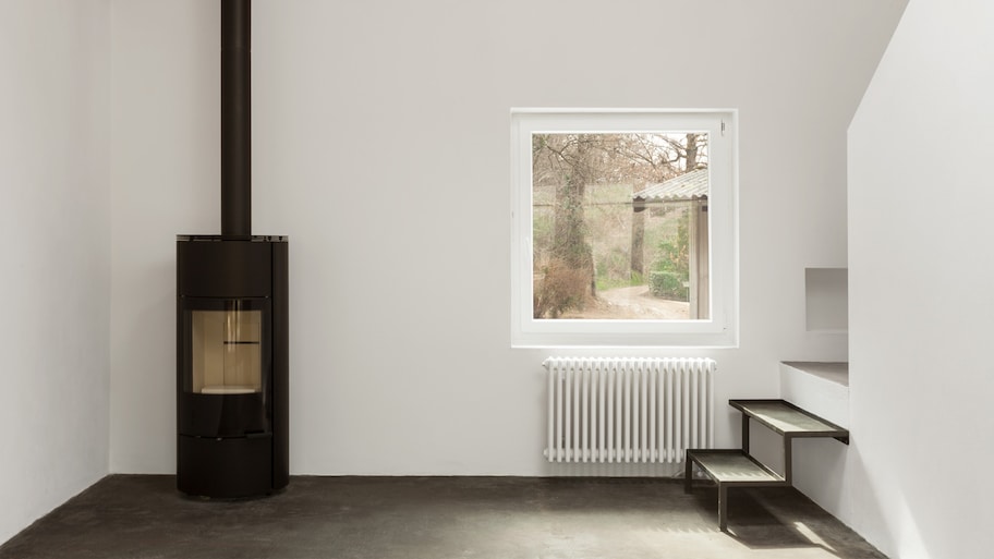 Minimalistic interior of a house with a pellet stove