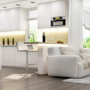 The interior of a modern living room with new vents above the kitchen