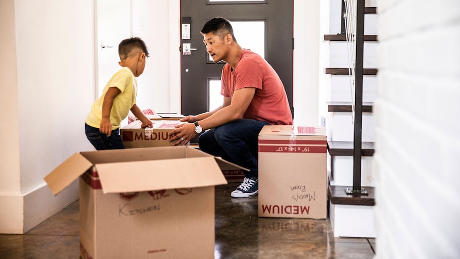 Father and son moving boxes