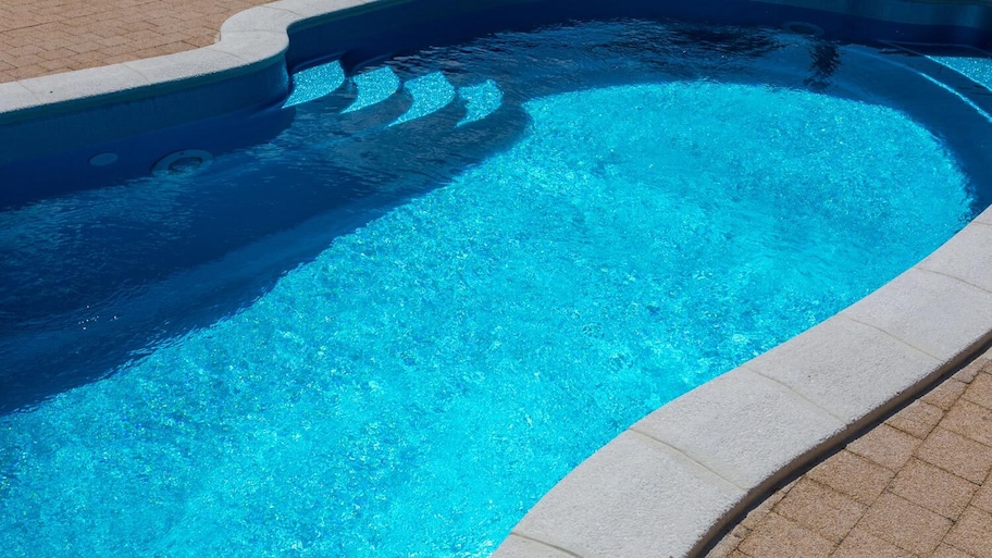 Overview of a swimming pool with a blue pool liner