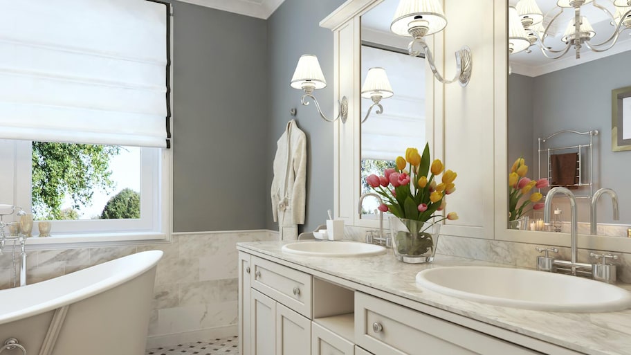 A white bathroom with two sinks