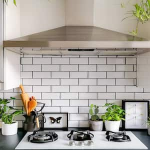 A countertop with kitchen backsplash tiles