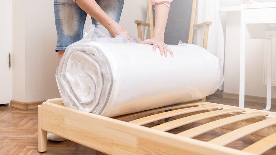  A woman packing a bed mattress