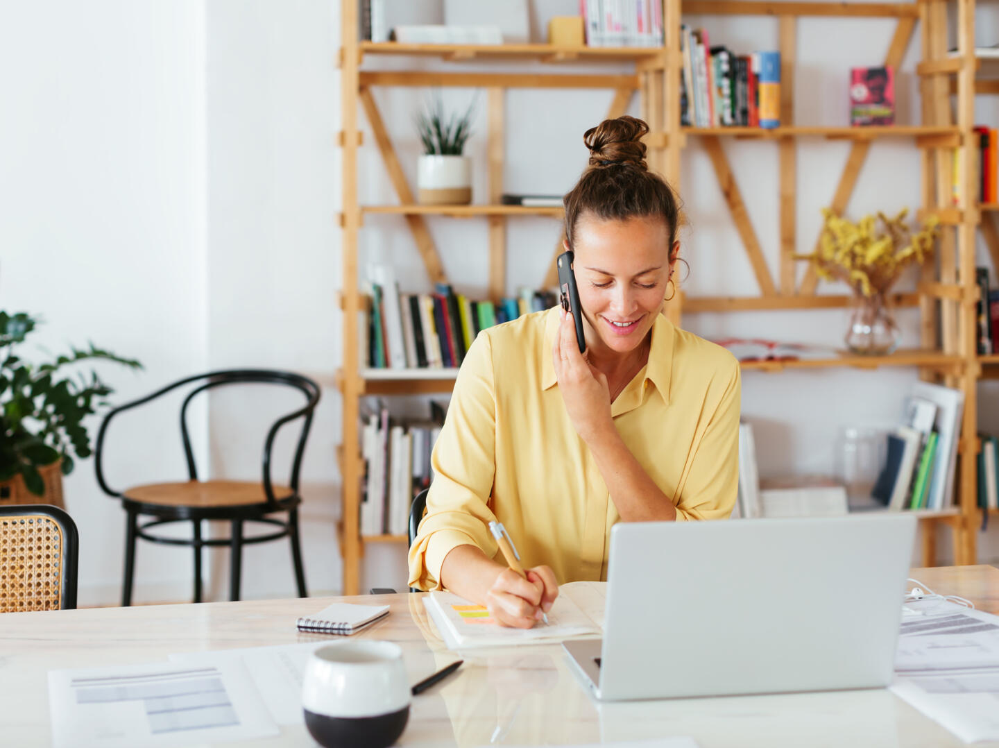 Cheerful Businesswoman Speaking With Client On Smartphone