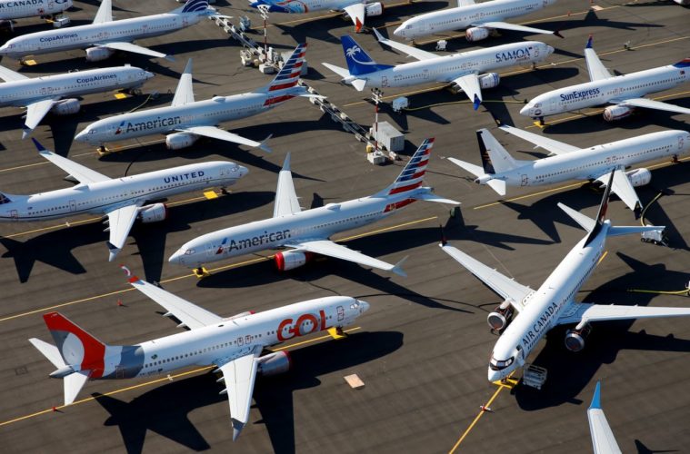 a group of airplanes parked on a runway