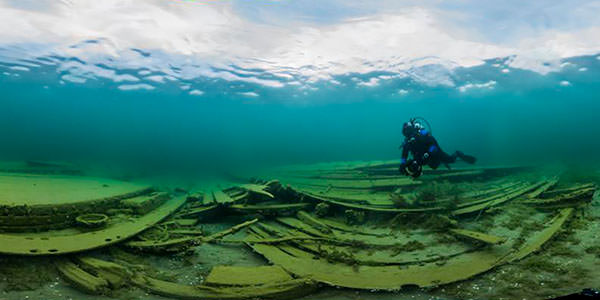 diver photographing the wreck of the wh stevens