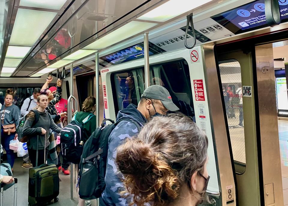 Passengers riding the Plane Train at Atlanta airport