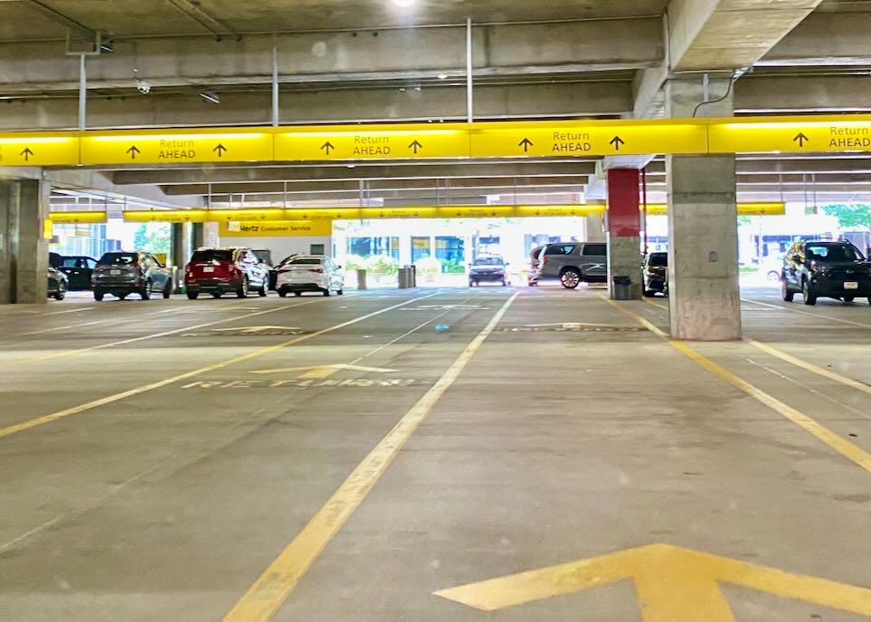 Lanes of arrows on the garage floor pointing to the return area.