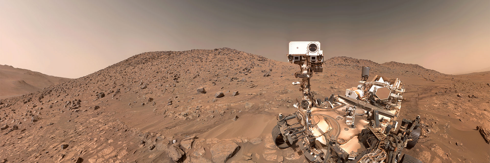 NASA’s Perseverance Mars rover took this selfie on July 23, 2024, the 1,218th Martian day, or sol, of the mission. To the left of the rover near the center of the image is the arrowhead-shaped rock nicknamed “Cheyava Falls,” which has features that may bear on the question of whether Mars was home to microscopic life in the distant past. The small dark hole in the rock is where Perseverance took a core sample, which is now in a sample tube stored in the rover’s belly. The white patch to the right of the hole is where the rover used an abrasion tool to clear away the top surface, allowing science instruments to study the rock’s composition.