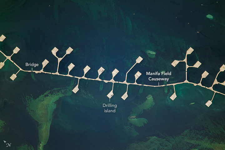 The causeway and its blocky “islands” off the eastern coast of Saudi Arabia make oil drilling possible in the region’s shallow waters.