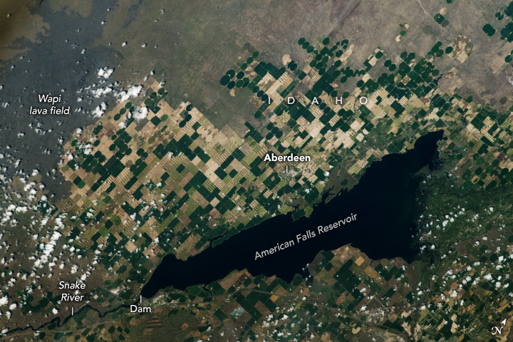 A patchwork of farmland along the Snake River abuts a flow of hardened lava.