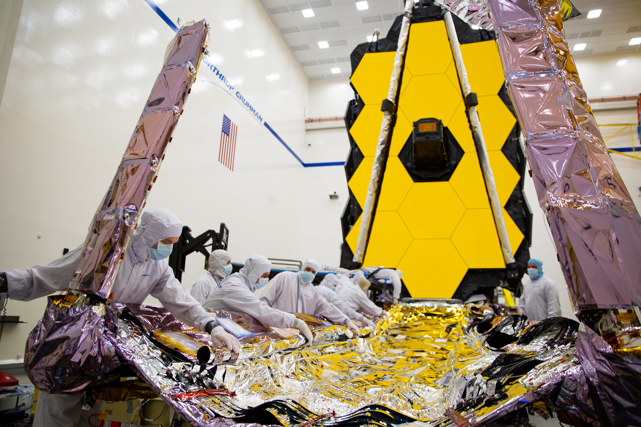 Webb in the Northrup Grumman clean room for final integration and test before launch. Technicials are preparing the sunshield and sunshield covers into their folded launch configuration