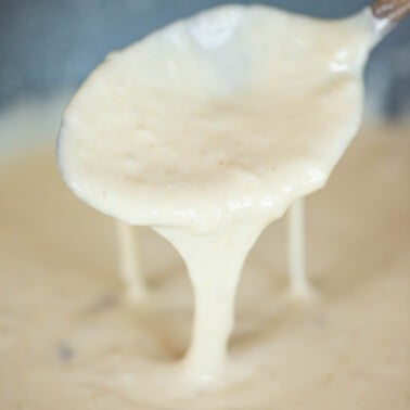 spoonful of homemade garlic infused creamy Alfredo sauce.