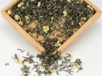 Bi Tan Piao Xue (Snow Drop Jasmine) scented green tea dry leaves in a wooden display box.